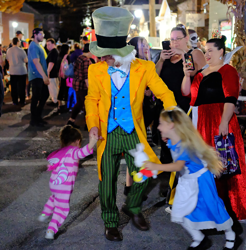 The Mad Hatter was kept busy by the kids at the Highland Halloween celebration.
